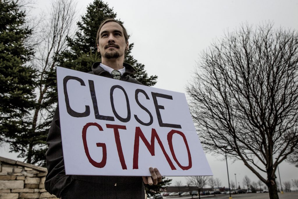 Kirk Brown Holds a "Close GTMO" Sign at the Iowa Anti-Torture Vigil
